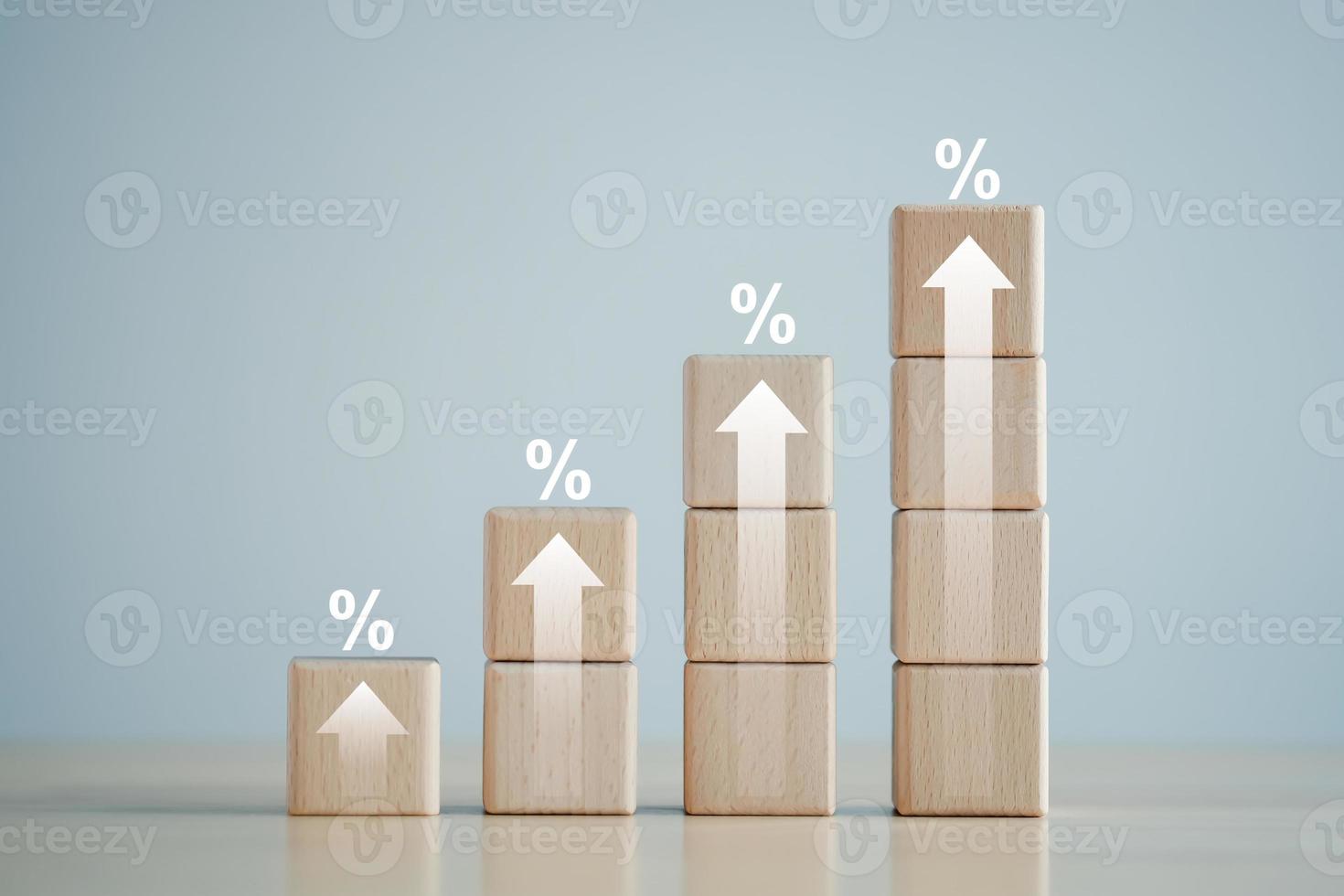 Interest rate finance and mortgage rates concept. percentage sign on  stack of wooden blocks and arrow up. financial growth, interest rate increase, inflation, sale price and tax rise concept. photo