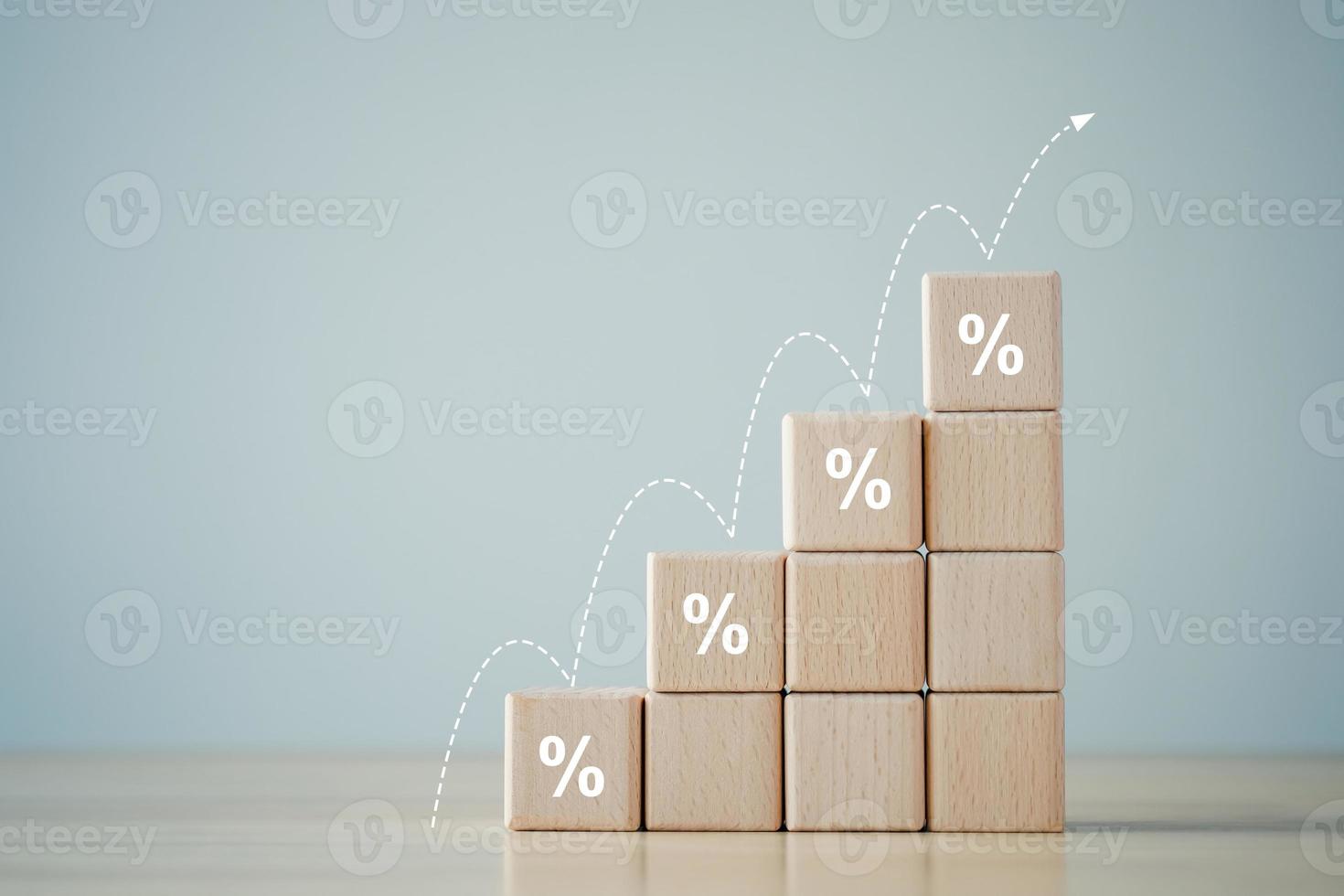 Interest rate finance and mortgage rates. percentage sign on  ladder of wooden block and growth step of arrow up. financial growth, interest rate increase, inflation, sale price and tax rise concept. photo