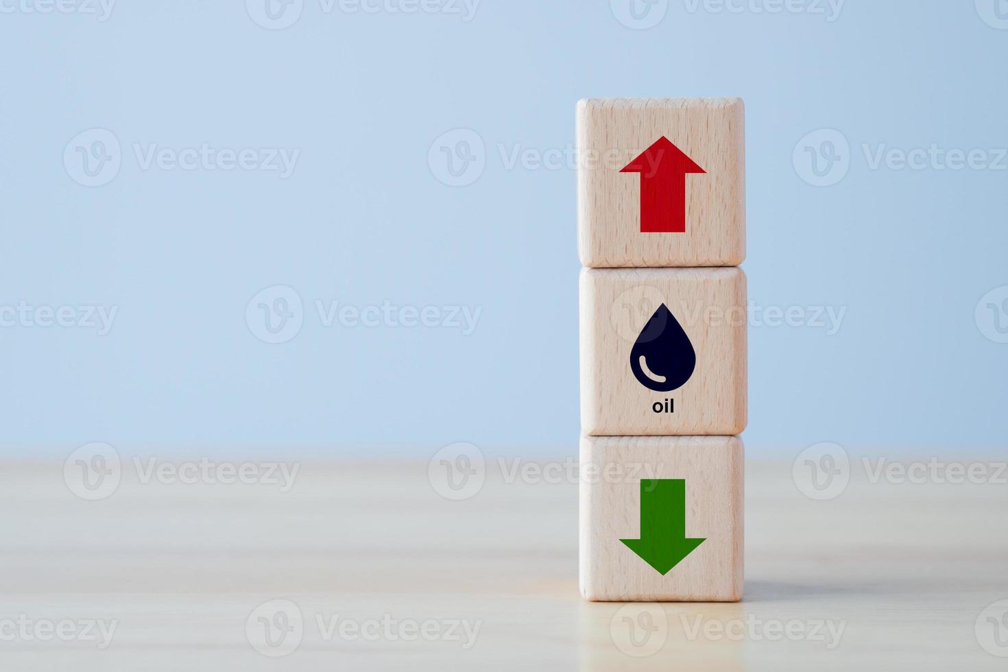 Oil price trend. Crude oil price stock exchange trading up. petroleum symbol on wooden block with arrow up and down. Falling or rising oil prices concept. Risk of war or crisis has raised the price. photo