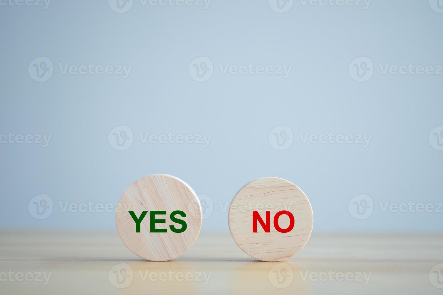 Green YES word and red No word on wooden circle for true or false changing mindset or way of adapting to change leader and transform quiz answer and election, survey and poll concept. photo