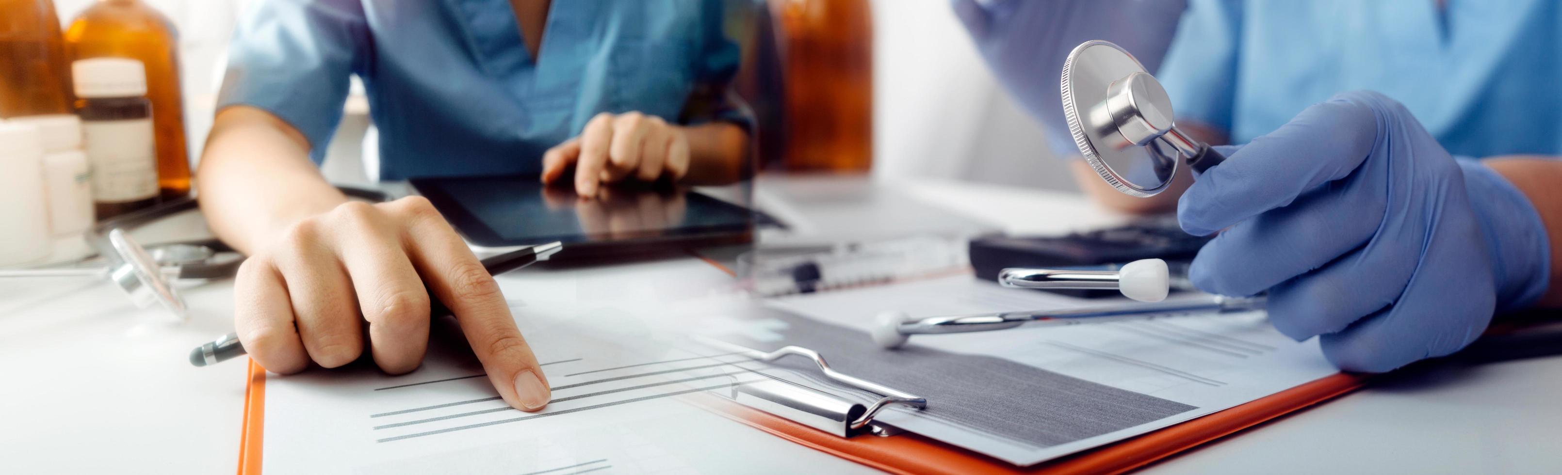 Medicine doctor hand working on a patients x-ray scans digital healthcare and connection with modern virtual screen interface icons, Medical technology and network concept. photo