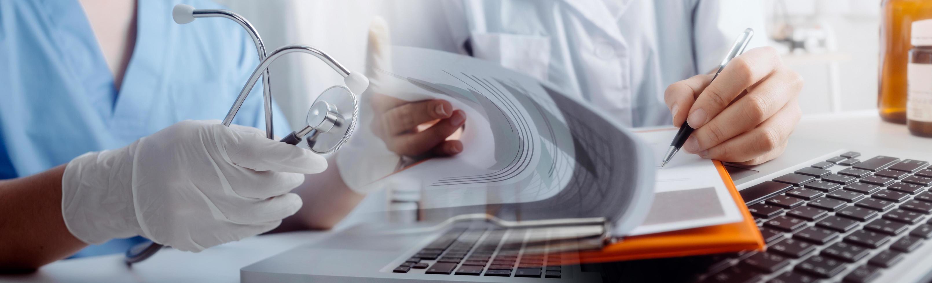 Medicine doctor hand working on a patients x-ray scans digital healthcare and connection with modern virtual screen interface icons, Medical technology and network concept. photo