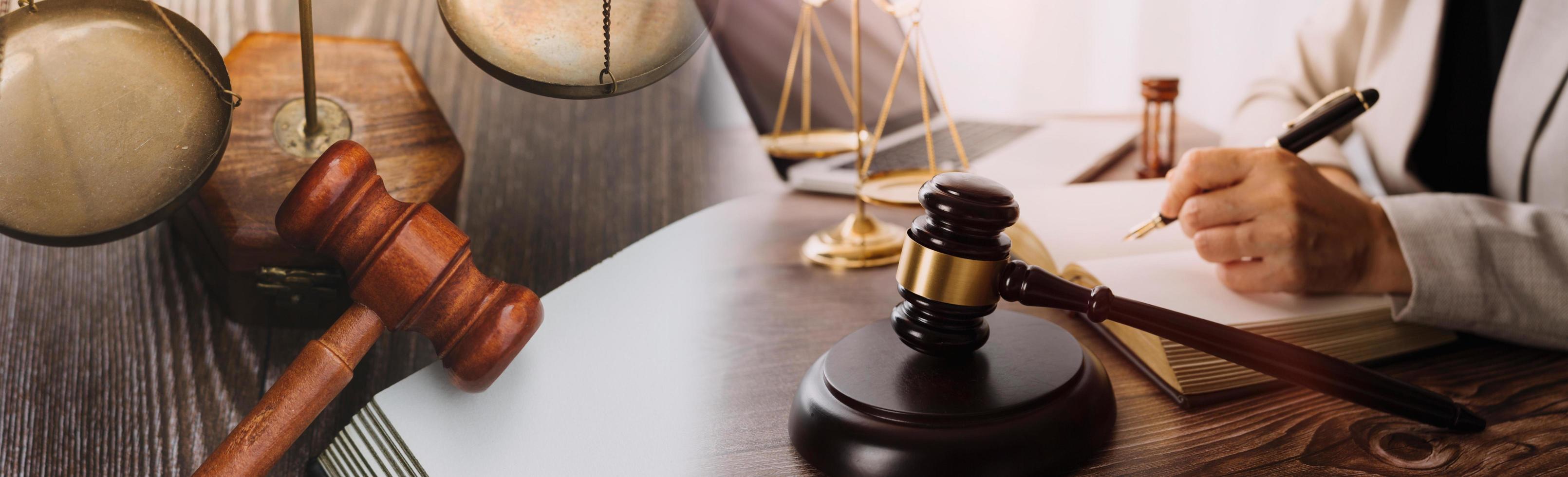Business and lawyers discussing contract papers with brass scale on desk in office. Law, legal services, advice, justice and law concept picture with film grain effect photo