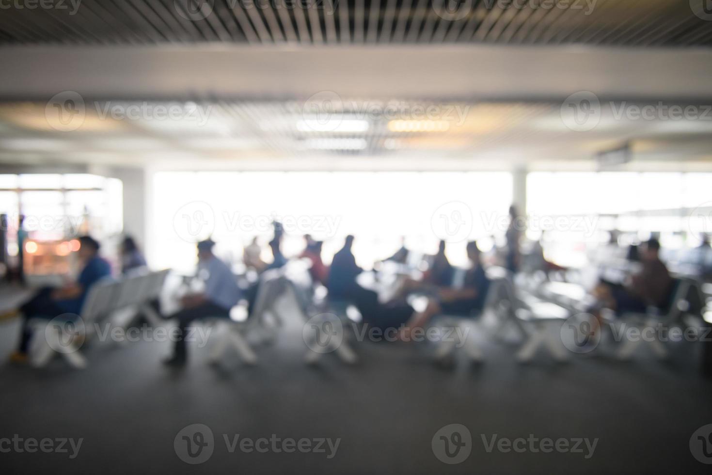 Blurred image of lifestyle at waiting chair zone in airport with bokeh for background usage photo