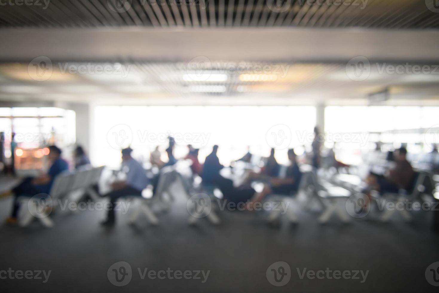 Blurred image of lifestyle at waiting chair zone in airport with bokeh for background usage photo