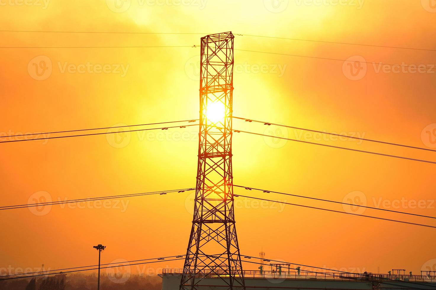 Transmission line tower and sunset photo