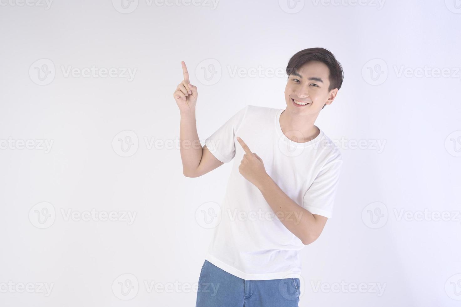 Portrait of young asian man over white background studio. photo