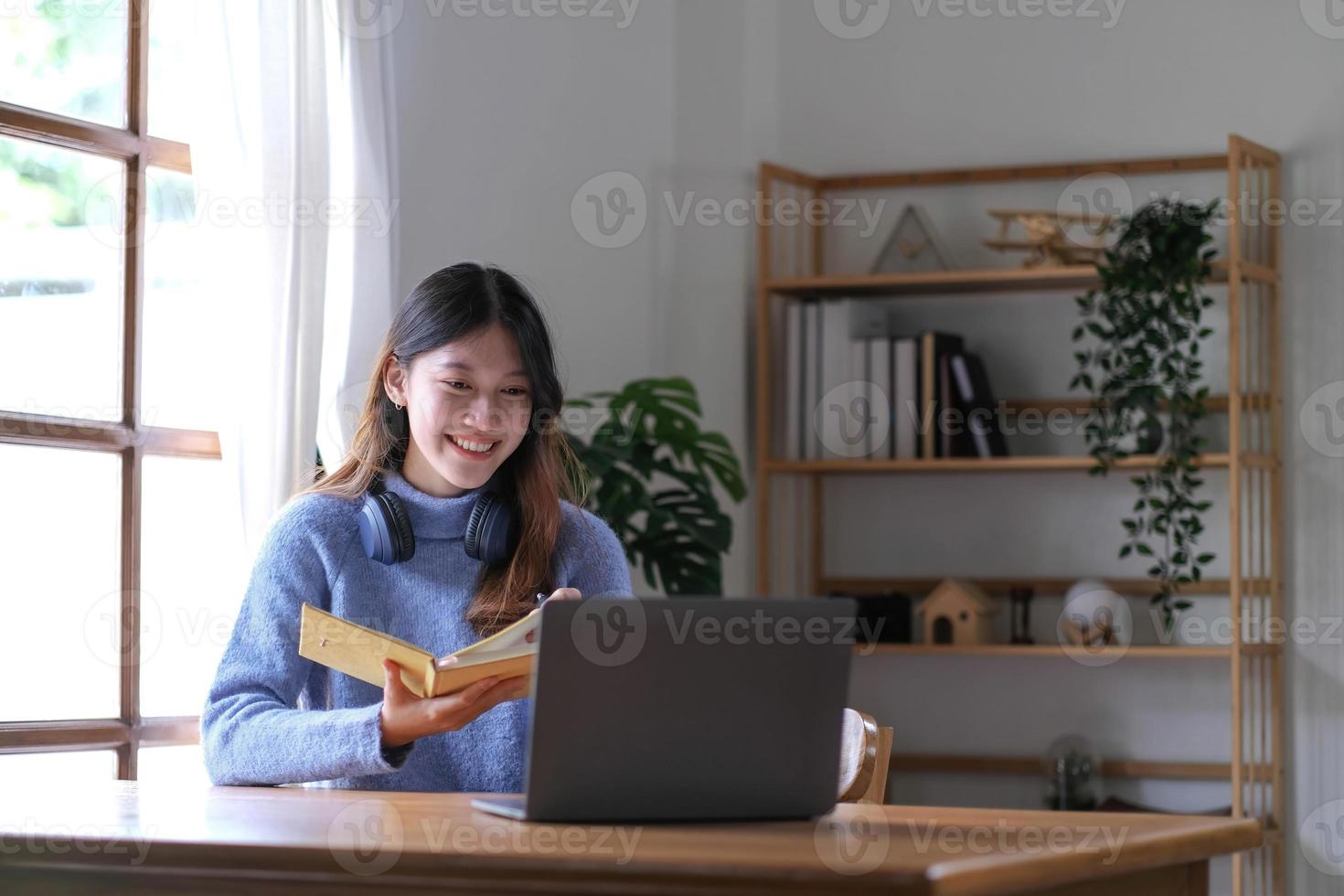 Asian girl student online learning class study online video call zoom teacher, Happy asian girl learn english language online with computer laptop. photo