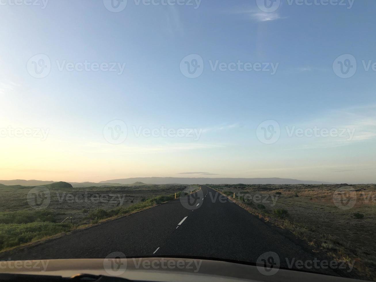 Empty road going through Iceland's beautiful southern landscape photo
