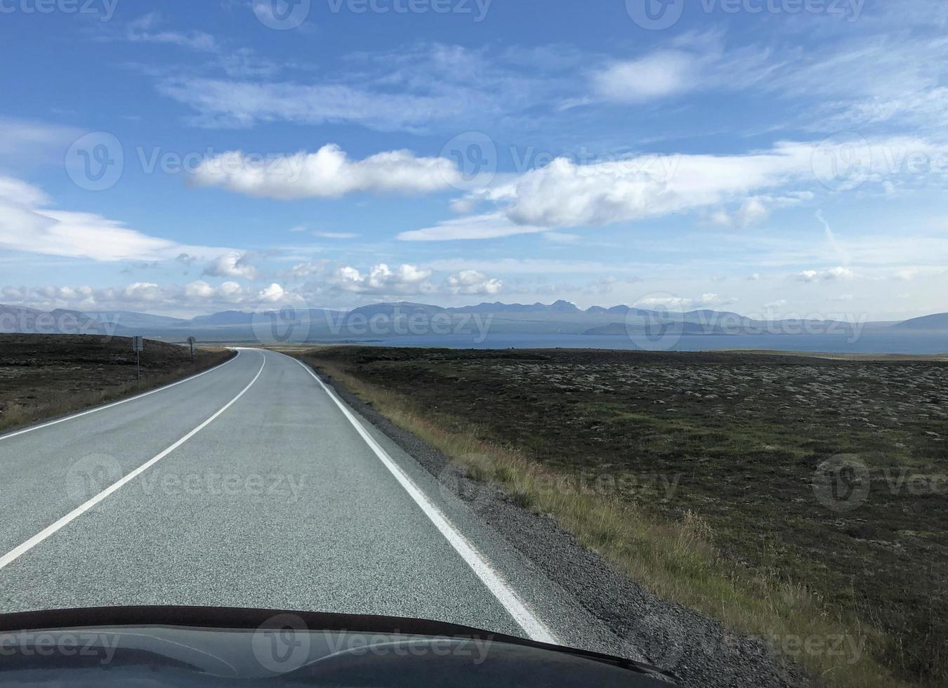 Empty road going through Iceland's beautiful southern landscape photo