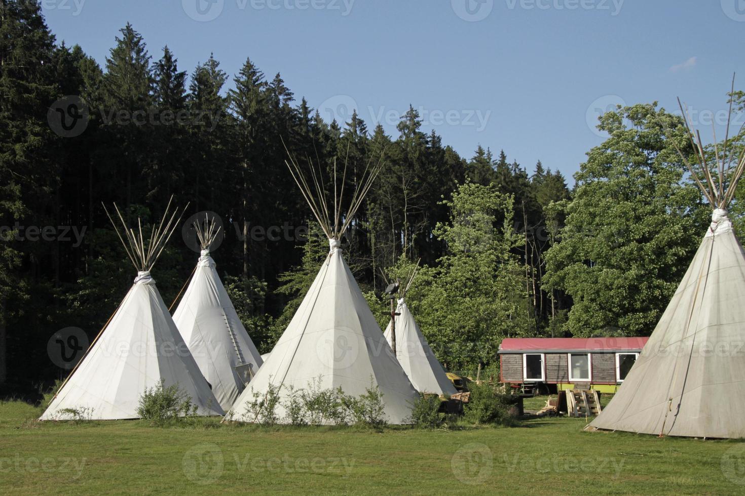 Tipis on a camping site in a forest in Germany photo