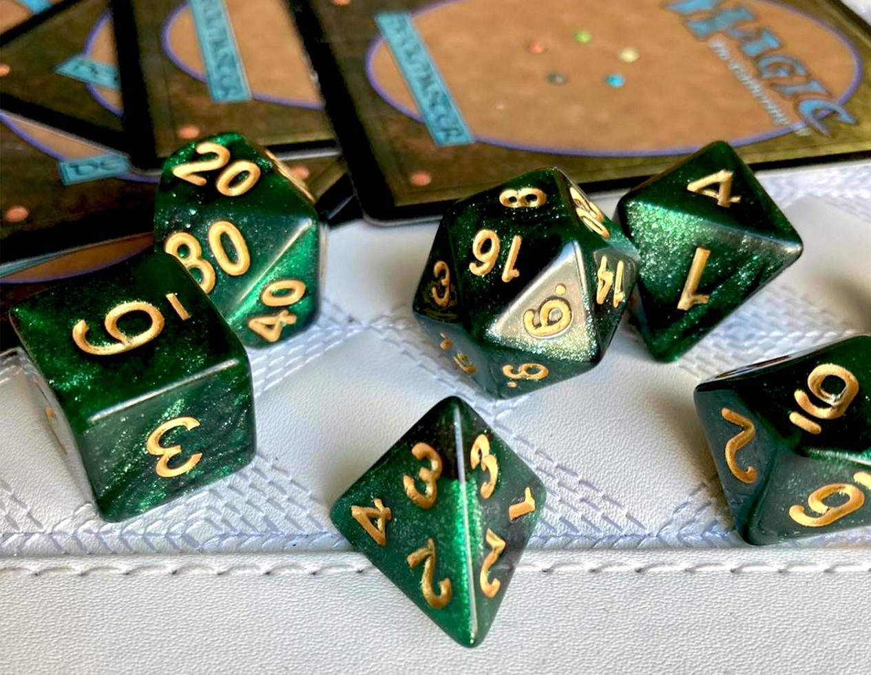 Dice game green polyhedral, MTG dice and cards. photo