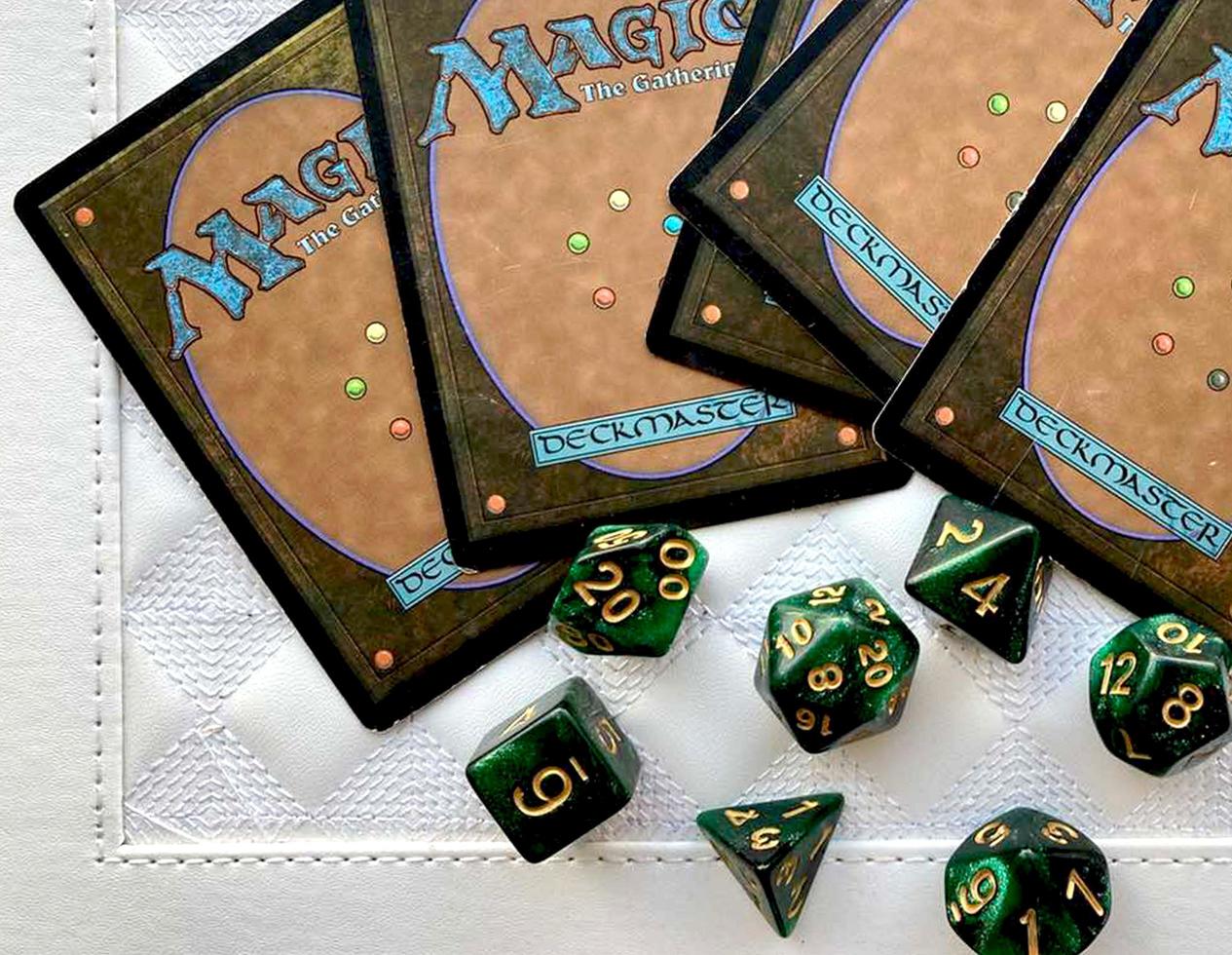 Dice game green polyhedral, MTG dice and cards. photo