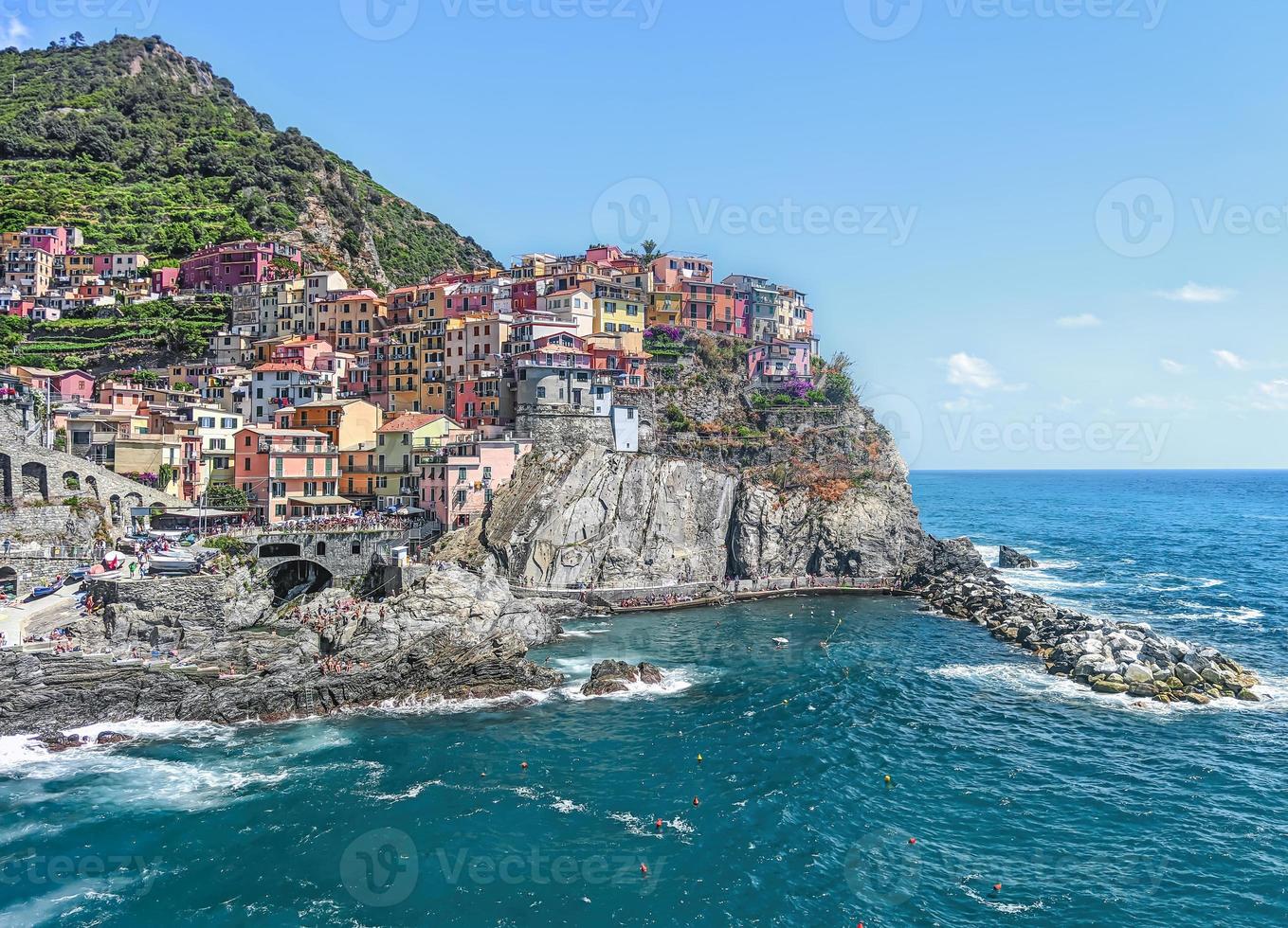 landscape of the tourist town called Riomaggiore, one of the fantastic 5 lands a famous tourist destination in Liguria photo