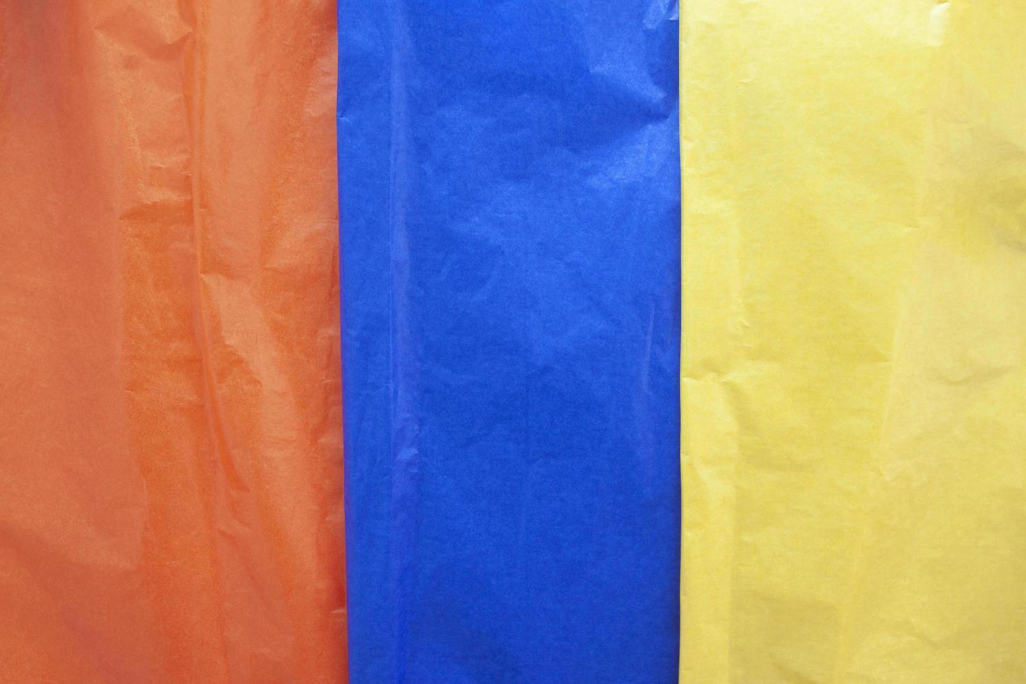 Textured of multi colored cellophane paper placed sort vertically for wrap candy or food for background. photo