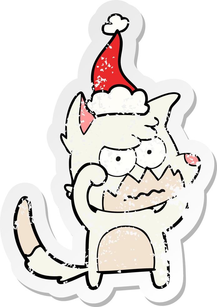 distressed sticker cartoon of a annoyed fox wearing santa hat vector