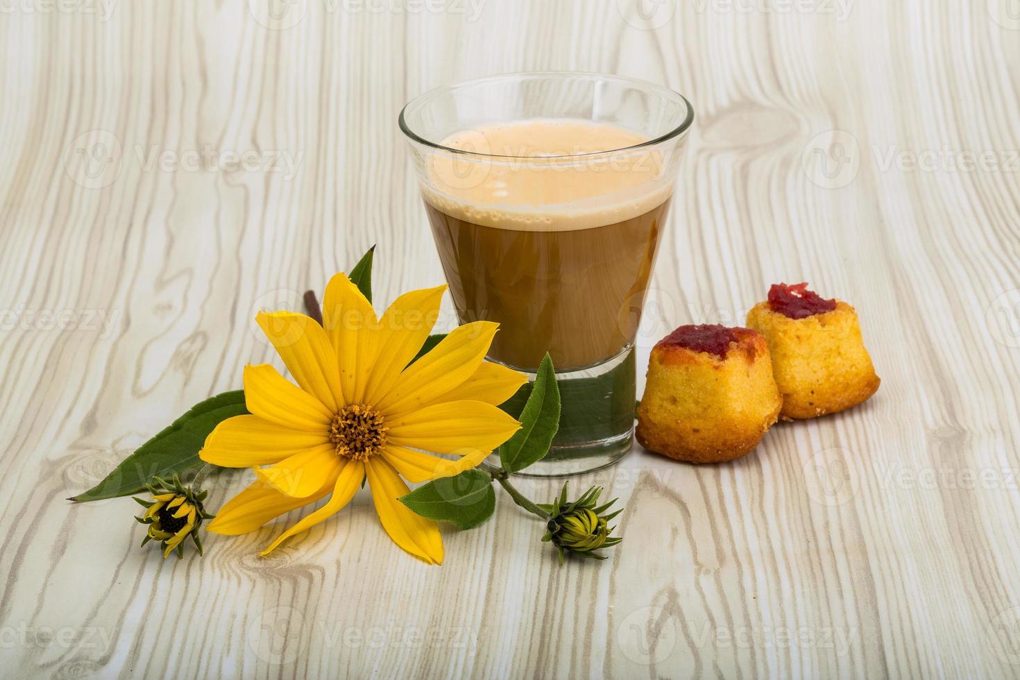 Coffee with milk on wooden background photo