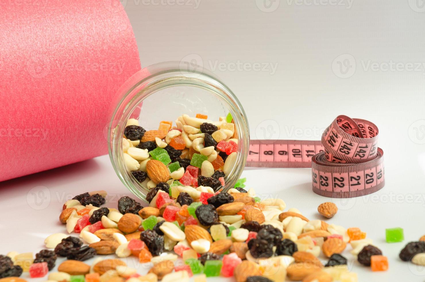 sports nutrition concept, nut mixture with candied fruits photo