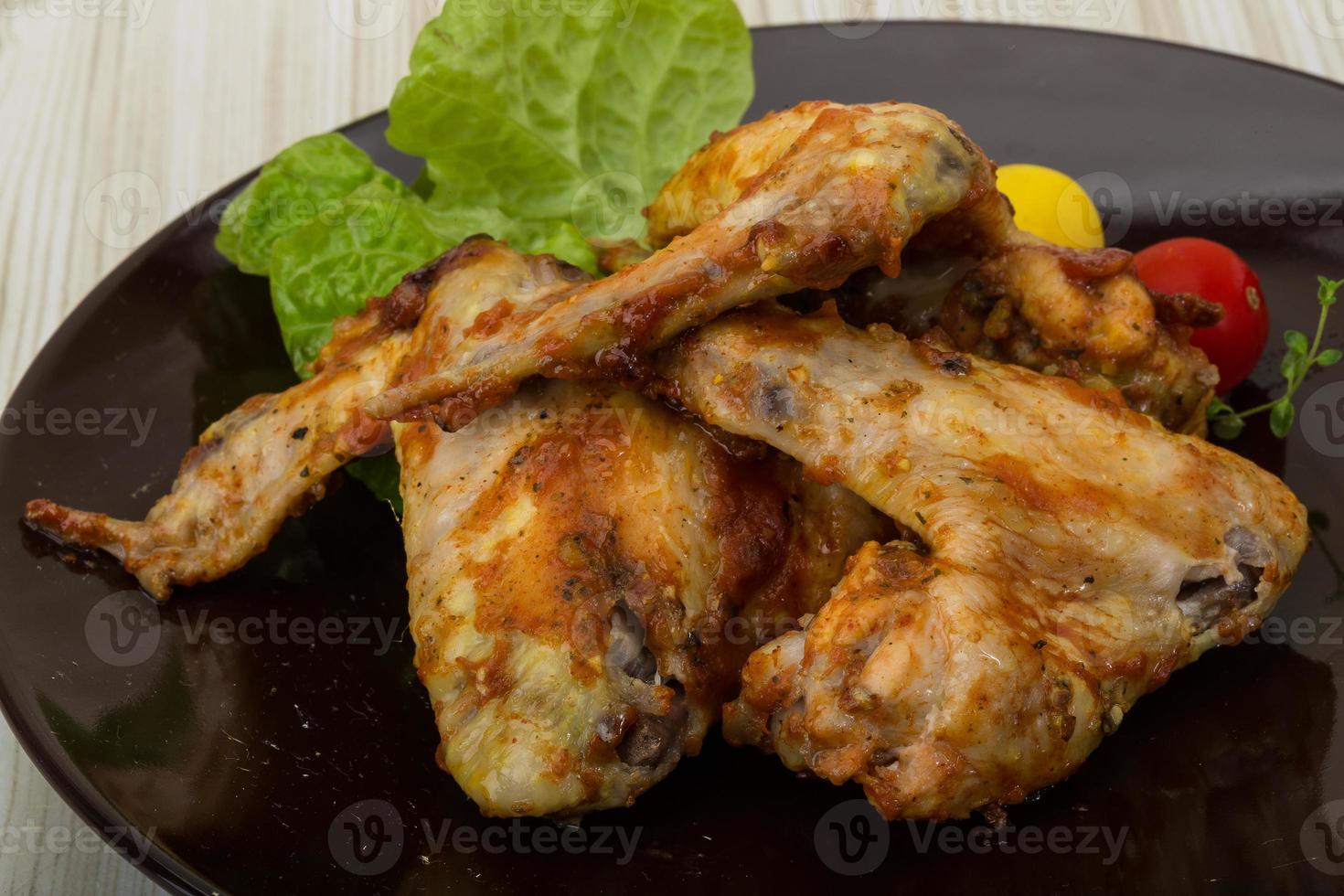 Chicken wings on the plate and wooden background 11723790 Stock Photo