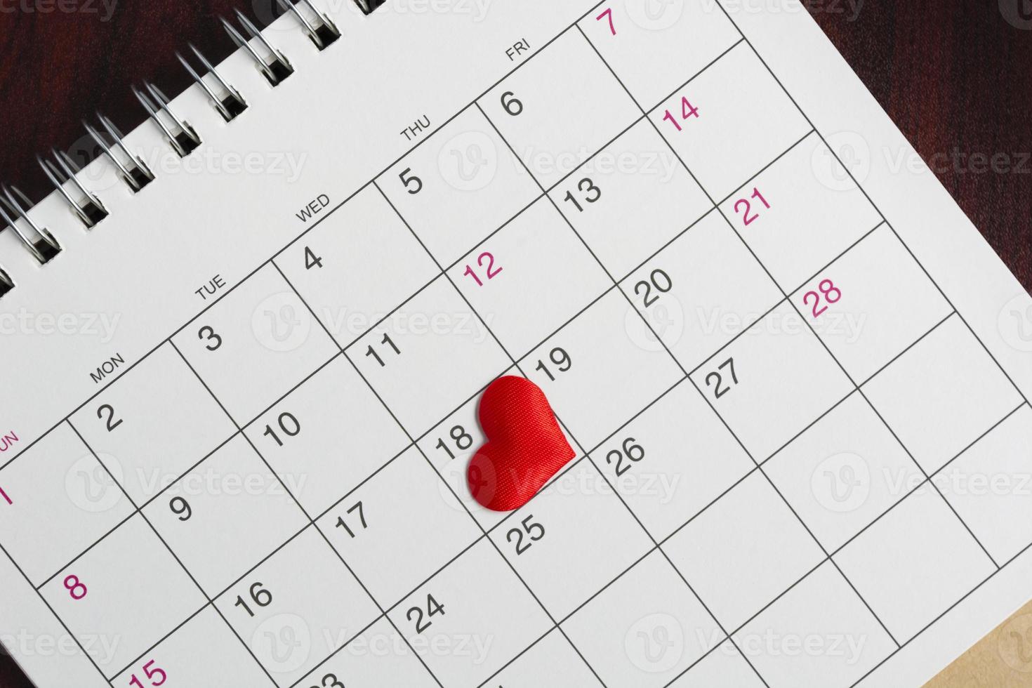 Red heart shape on the date of the 18th day in the calendar. photo