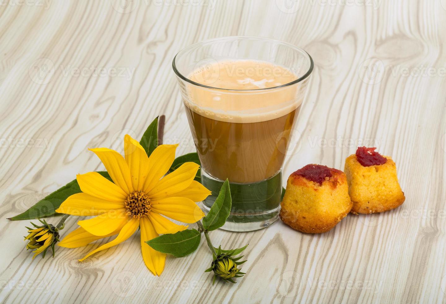 Coffee with milk on wooden background photo