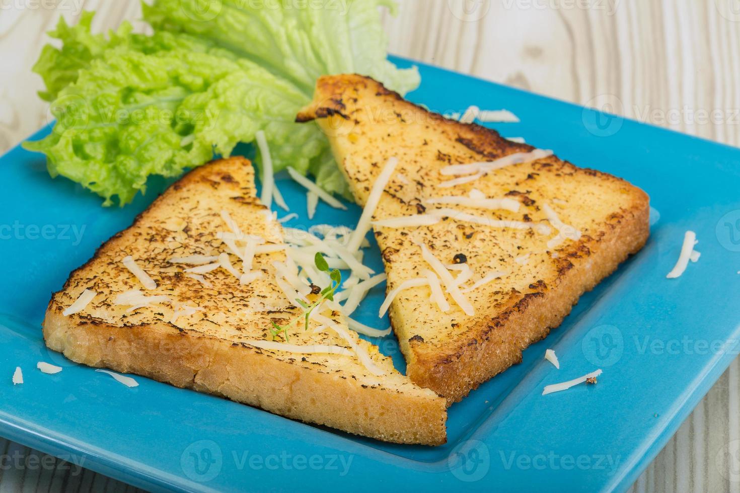 French toast on the plate and wooden background photo