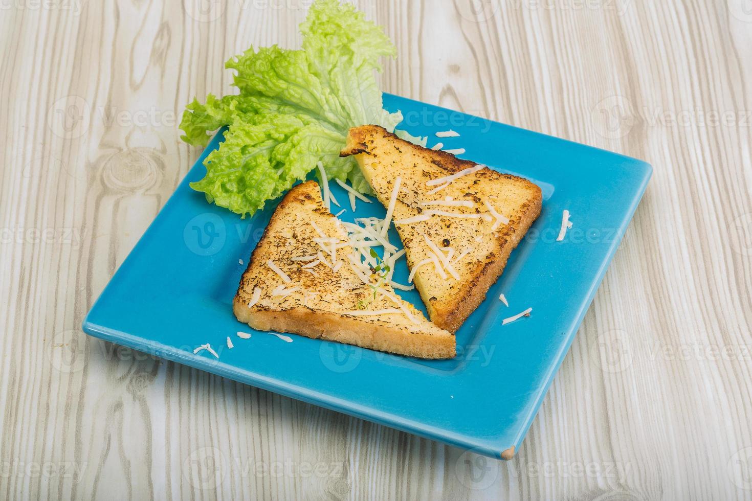 French toast on the plate and wooden background photo