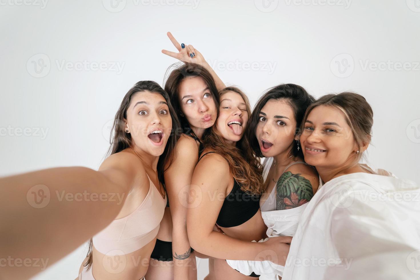 Diverse models wearing comfortable underwear take selfie photo