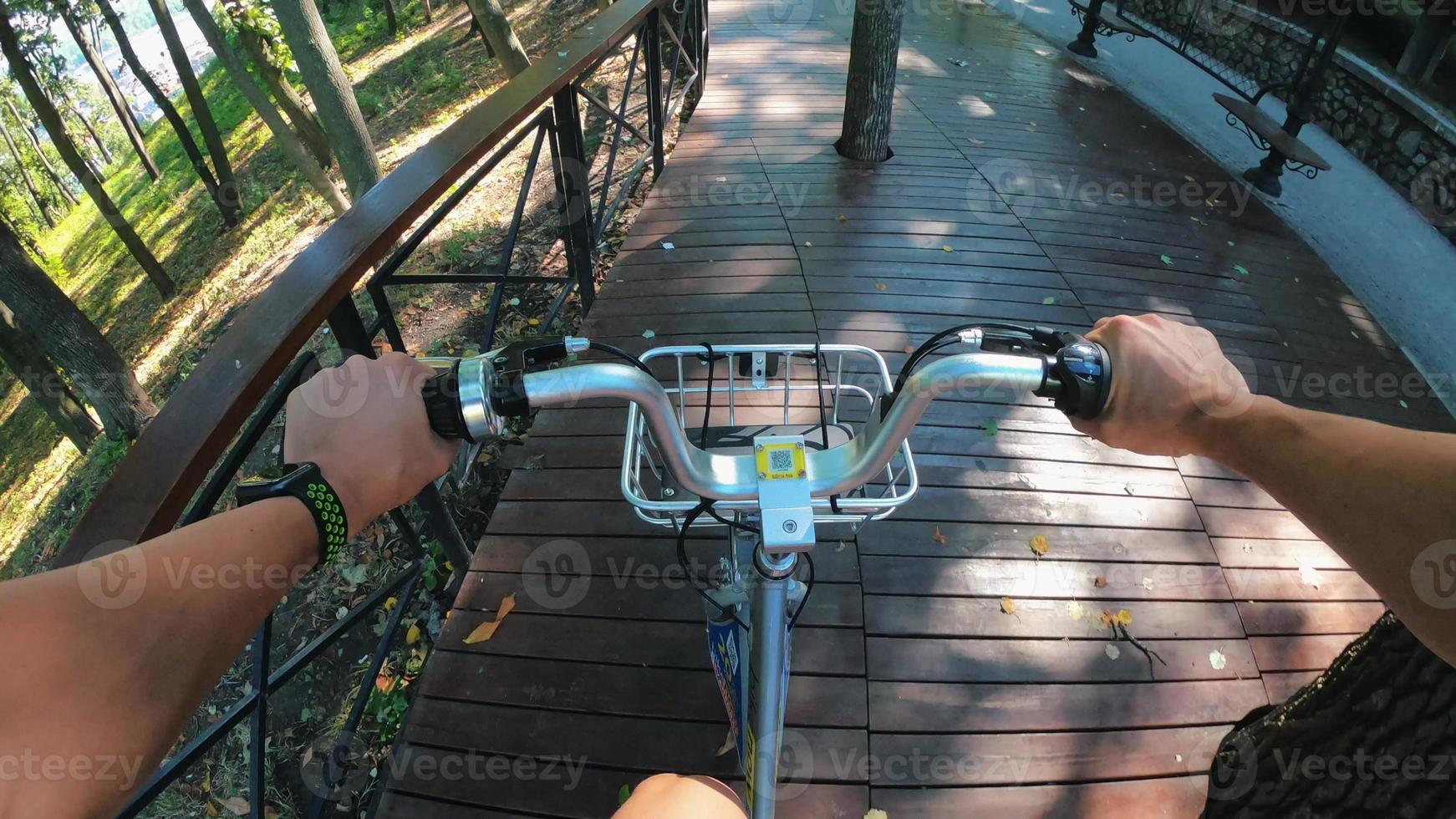 A view from the first person to the steering wheel, hands and road. photo