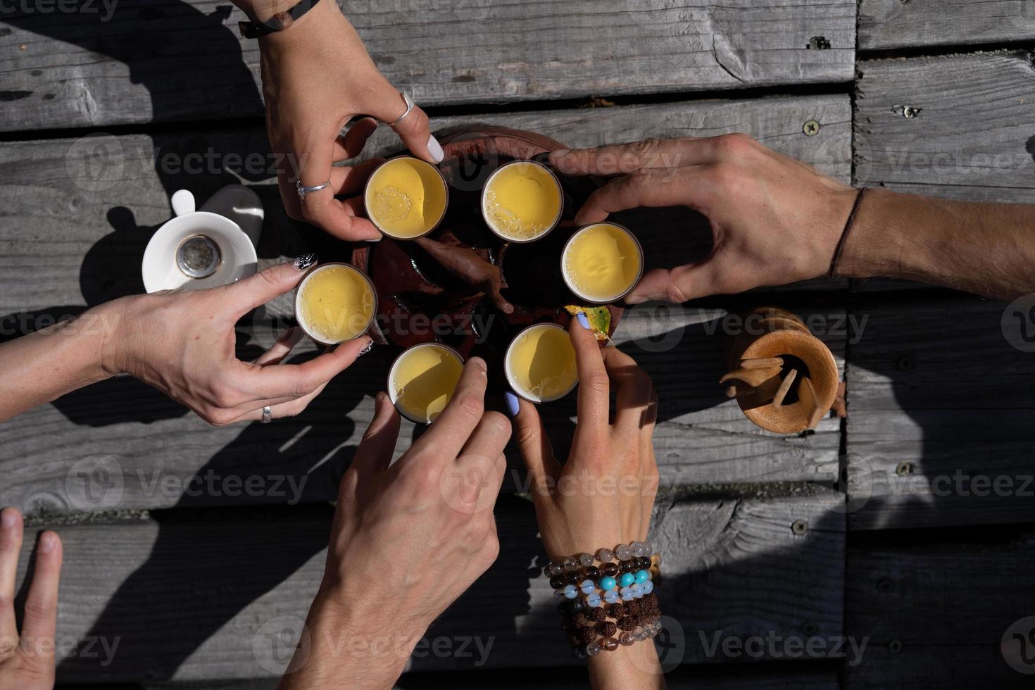 Top view tea set a wooden table for tea ceremony background. Woman and man holding a cup of tea photo