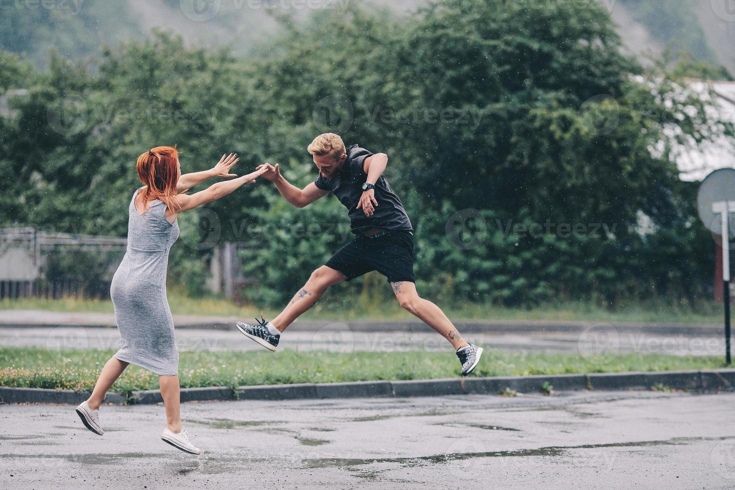 beautiful couple in the rain photo