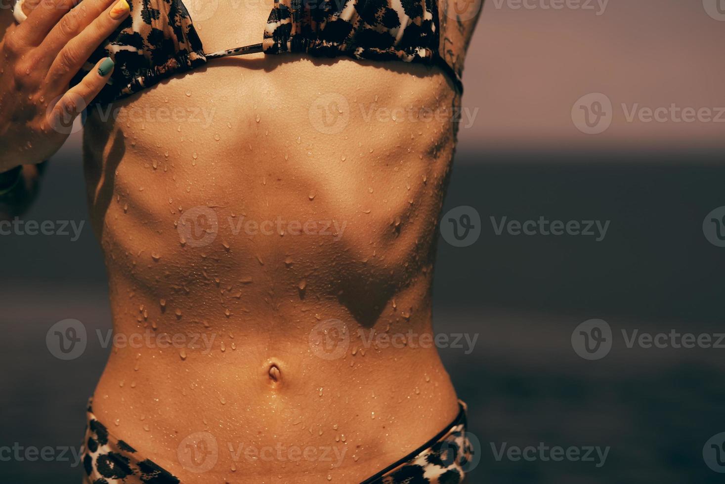Torso of slim attractive female with flat belly in white underwear. photo