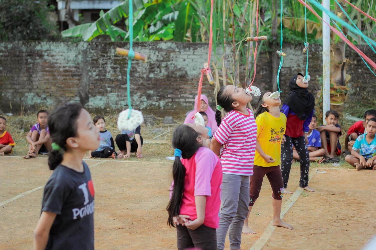 Magetan, Indonesia. August 17, 2022. Indonesian children are happy to celebrate Indonesia's independence day by participating in a competition. photo