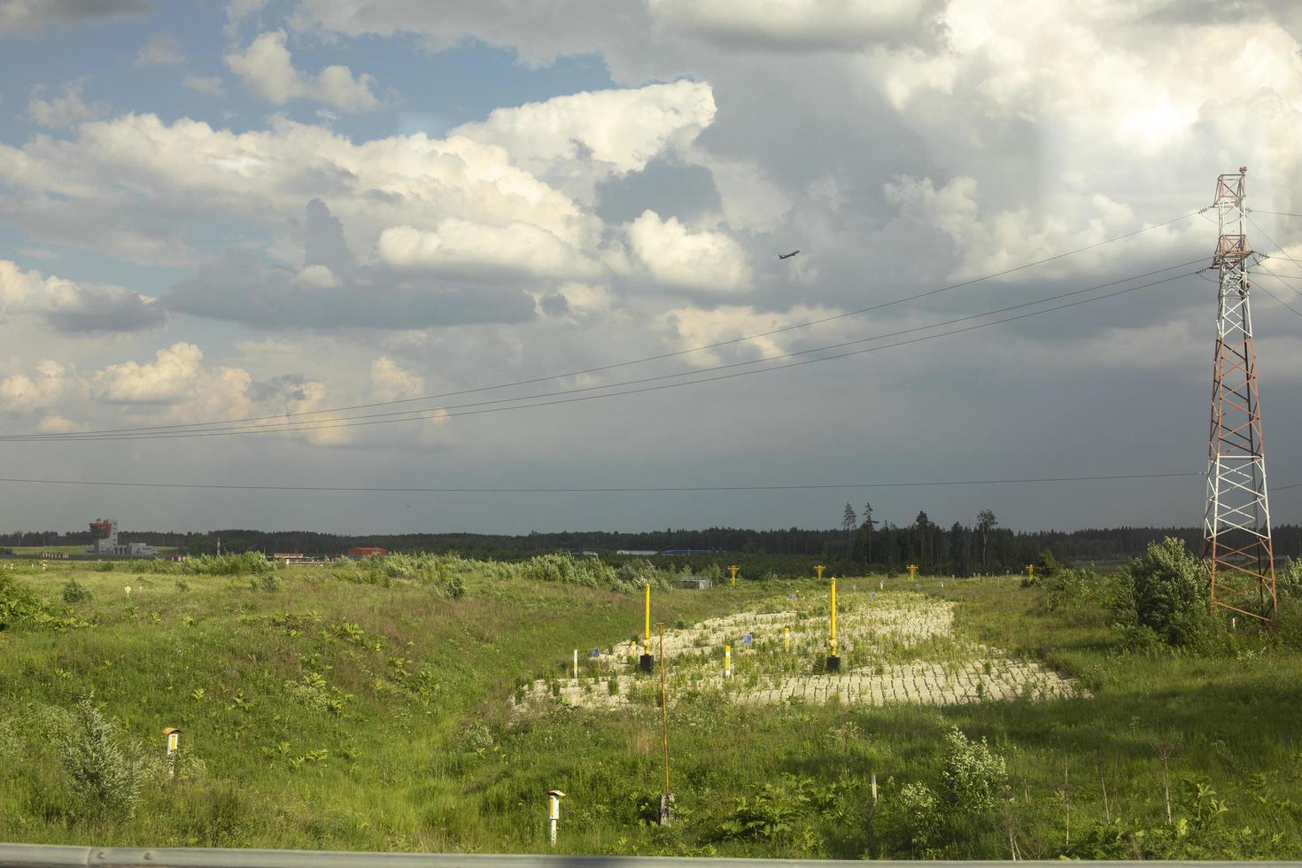 Communication tower in field. Details of radio infrastructure. photo