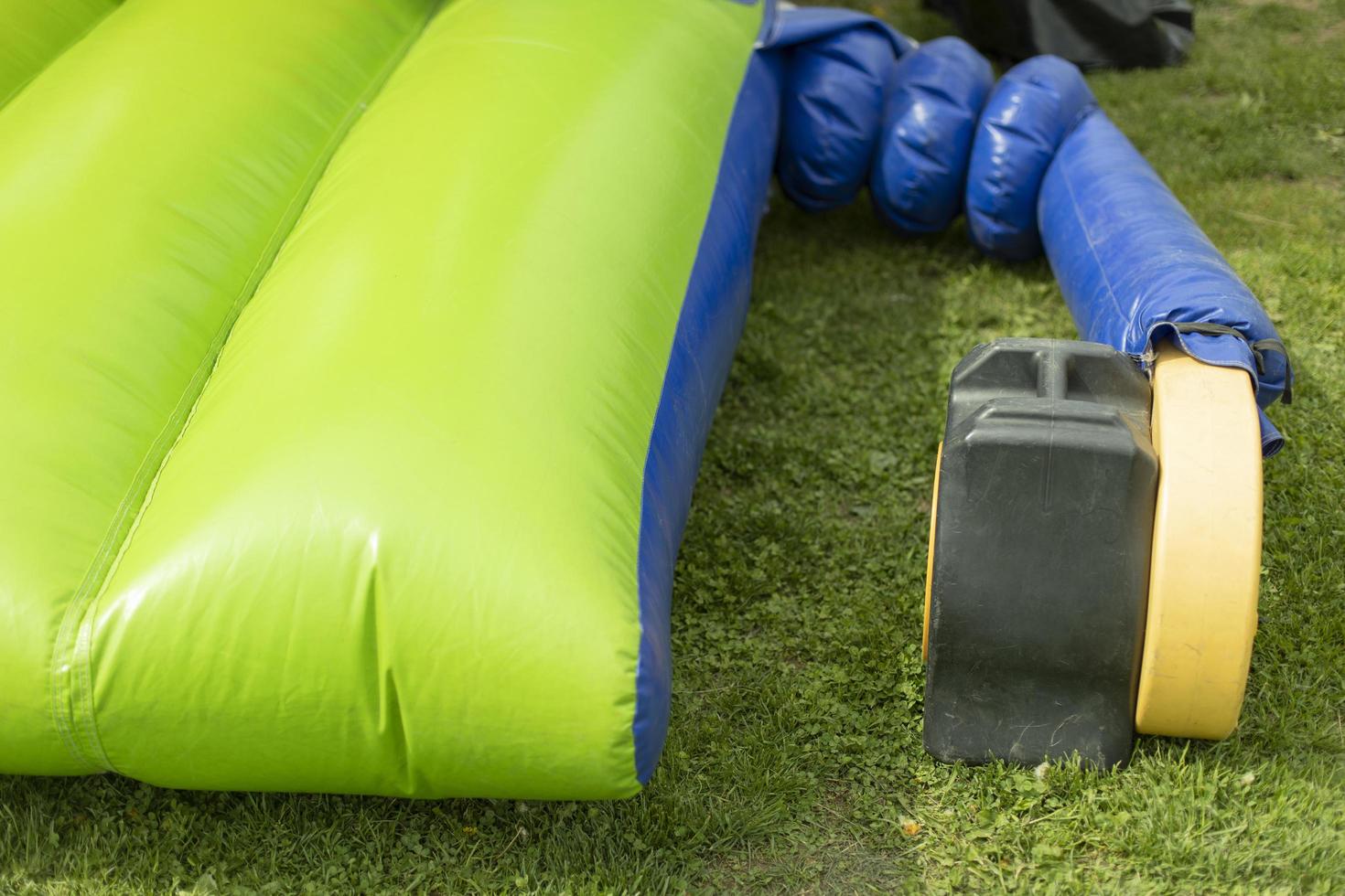 Inflate obstacle course using air generator. photo