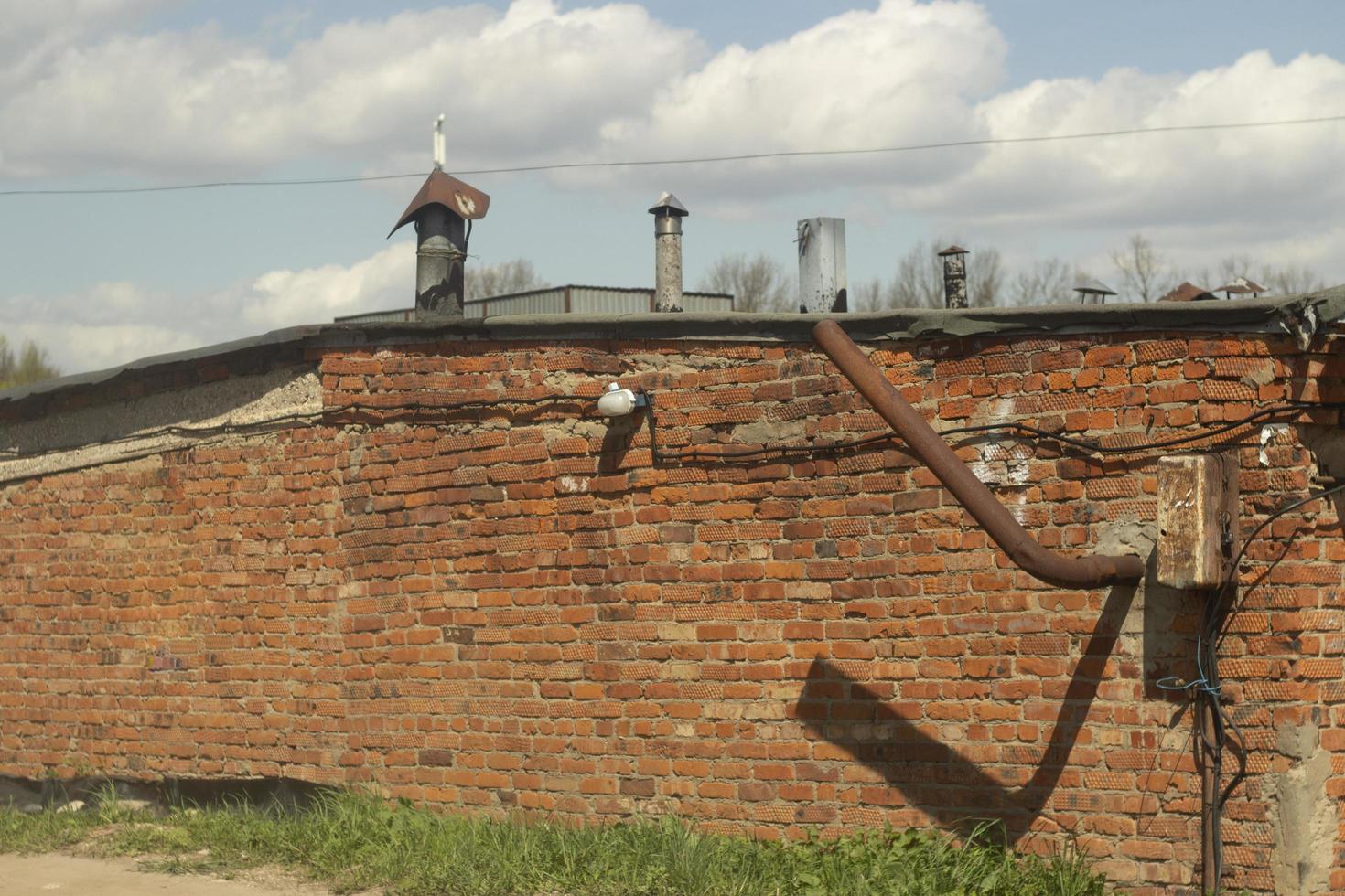 Old building in city. Industrial area. Details of industrial-looking architecture. photo