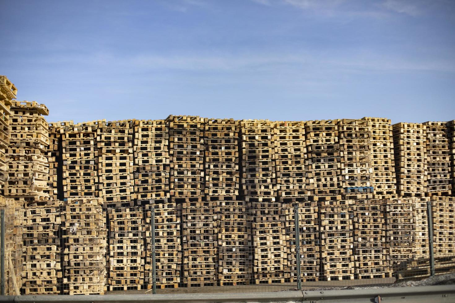 Lots of pallets. Warehouse of wooden pallets. Boarding. photo