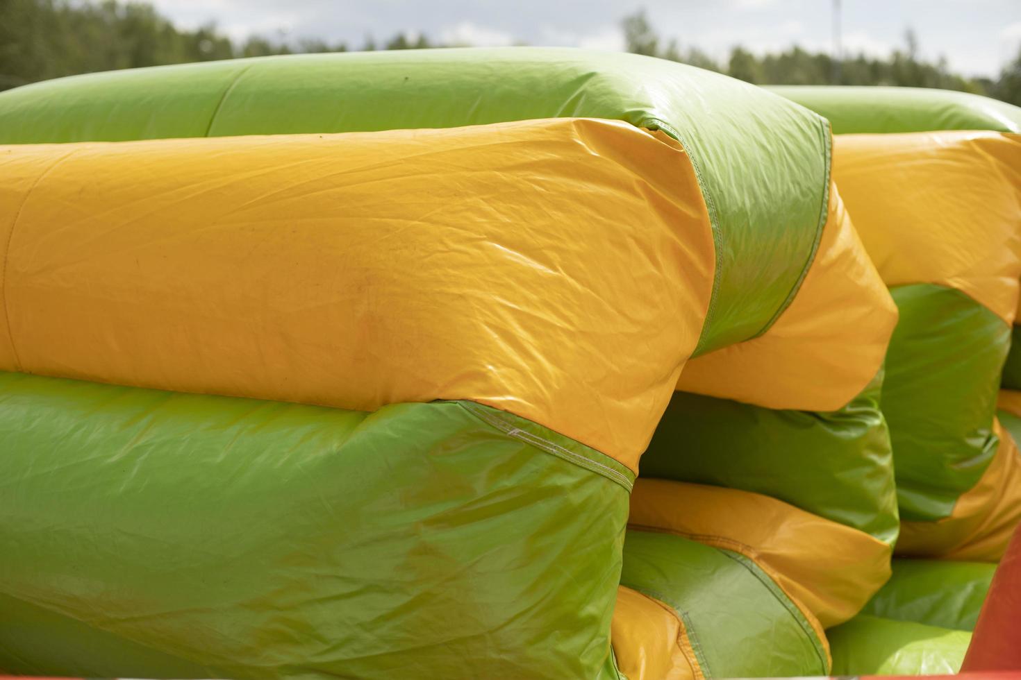 Inflatable construction in amusement park. Obstacle course for children. photo