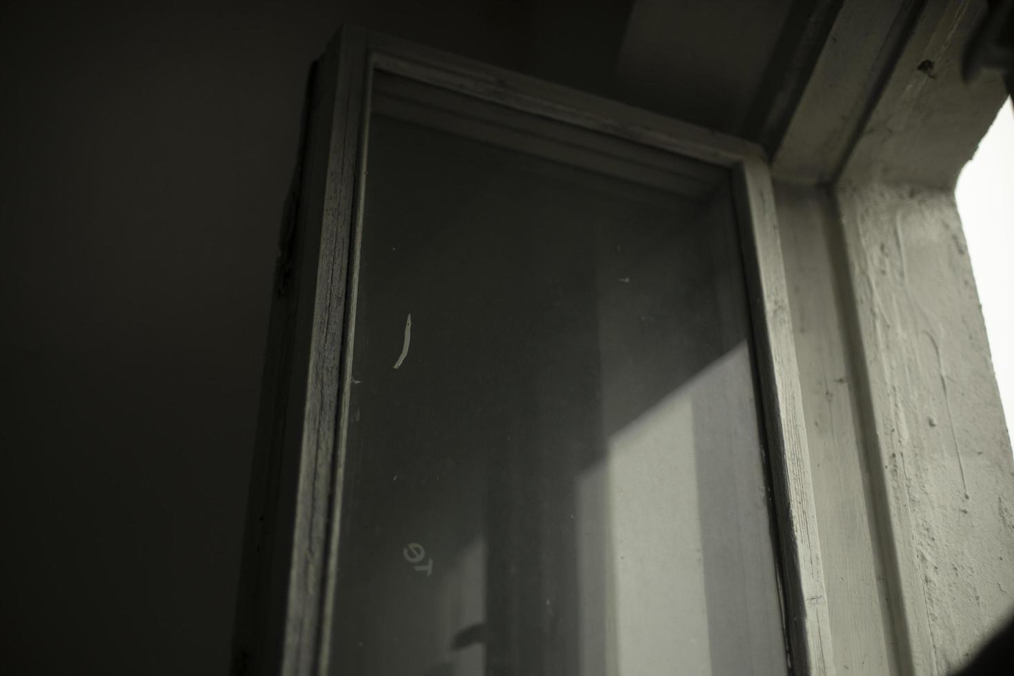 Old window. Wooden frame and glass. Interior details. photo