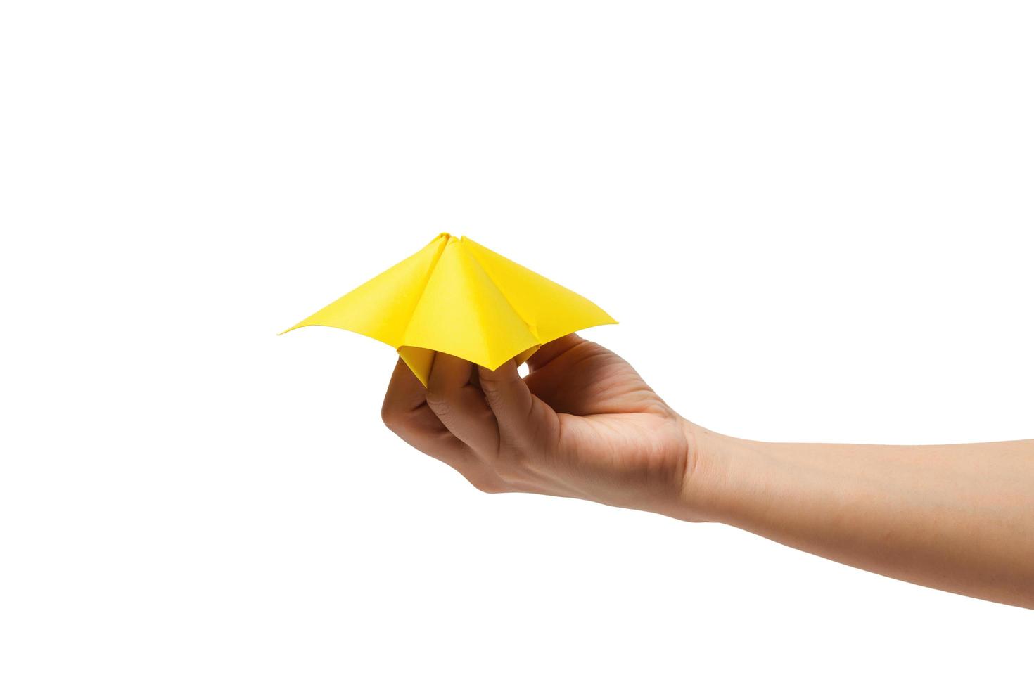 Close up of hand in a paper fortune teller isolated on white background photo