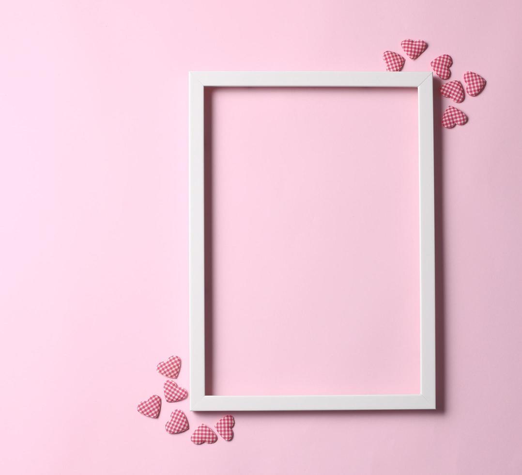 Valentine's day background - frame on pastel pink background photo