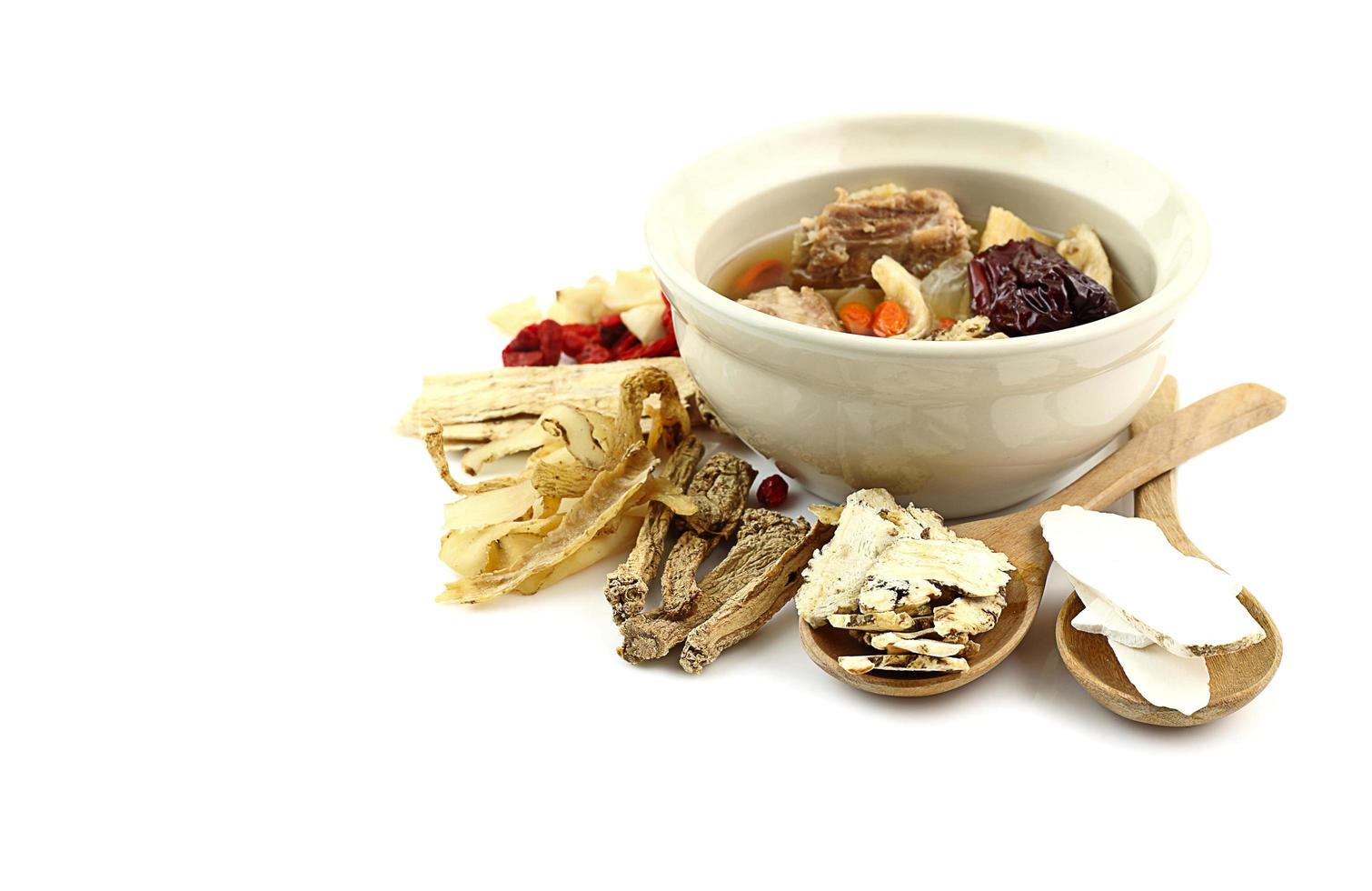 Many chinese herbal medicine on white background for healthy soup photo