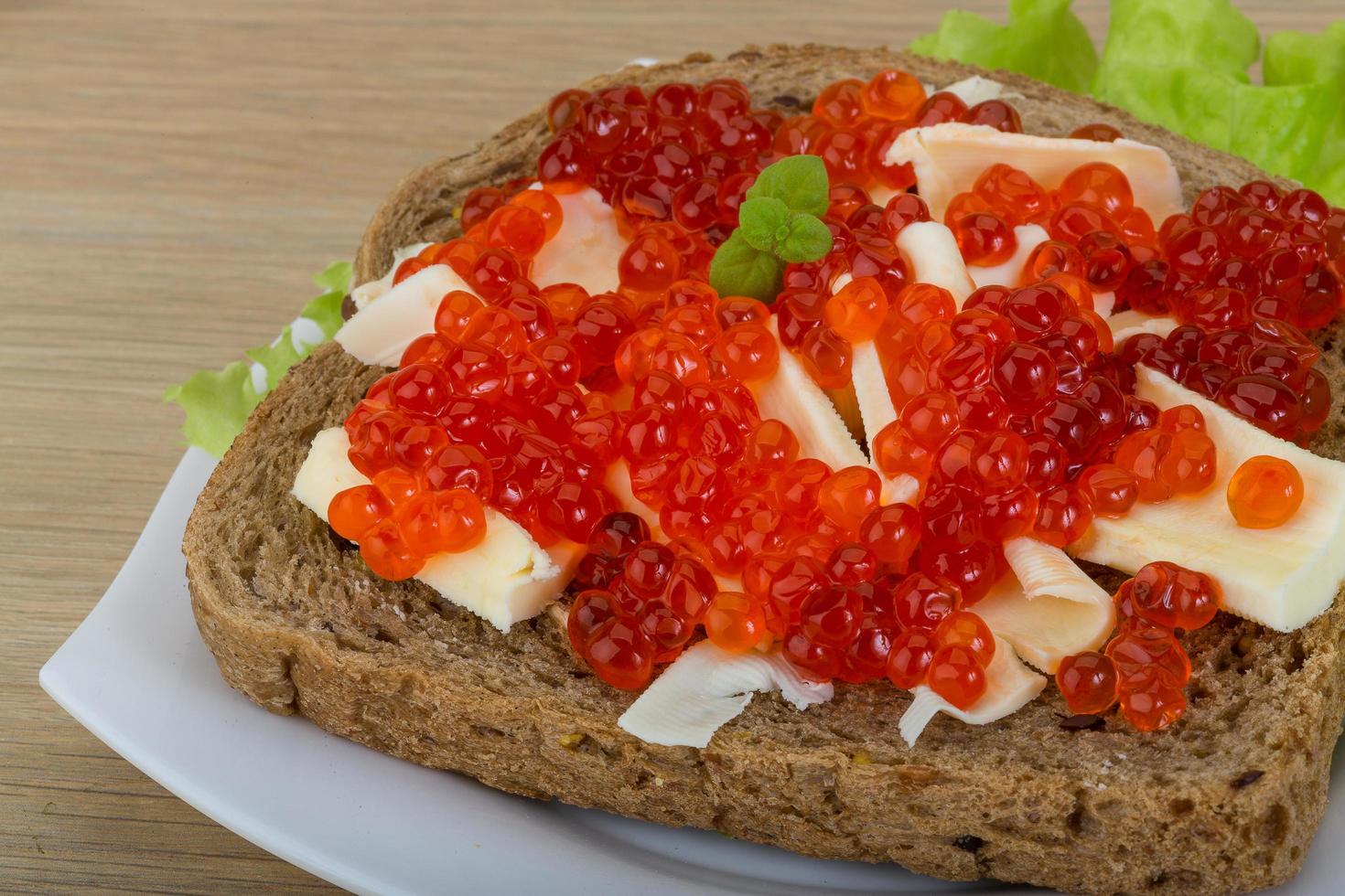Sandwich with red caviar photo
