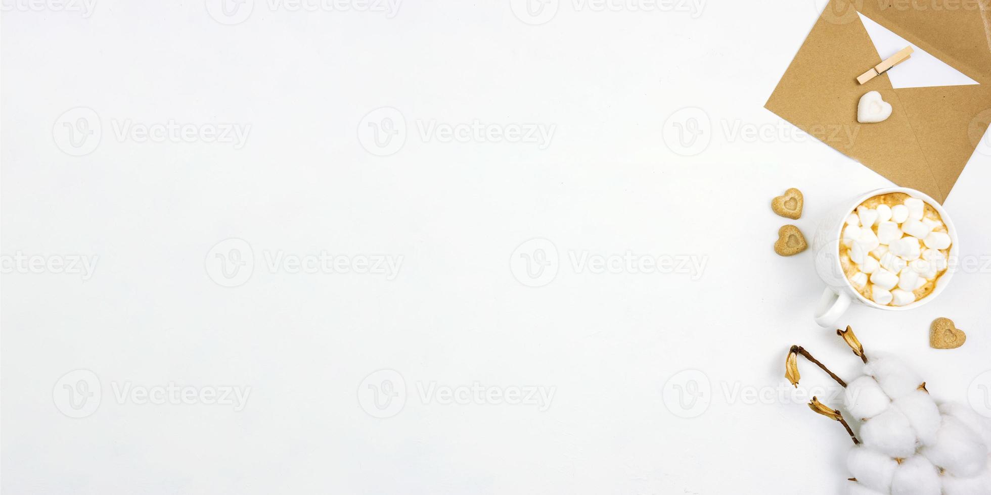 Flat lay of cappuccino with marshmallow with white hearts biscuits around and brown sugar. Banner. Copy space photo
