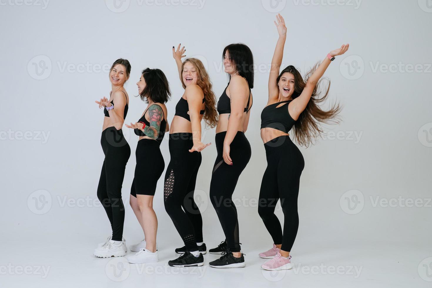 diverse models laughing, enjoying time together, look at camera photo