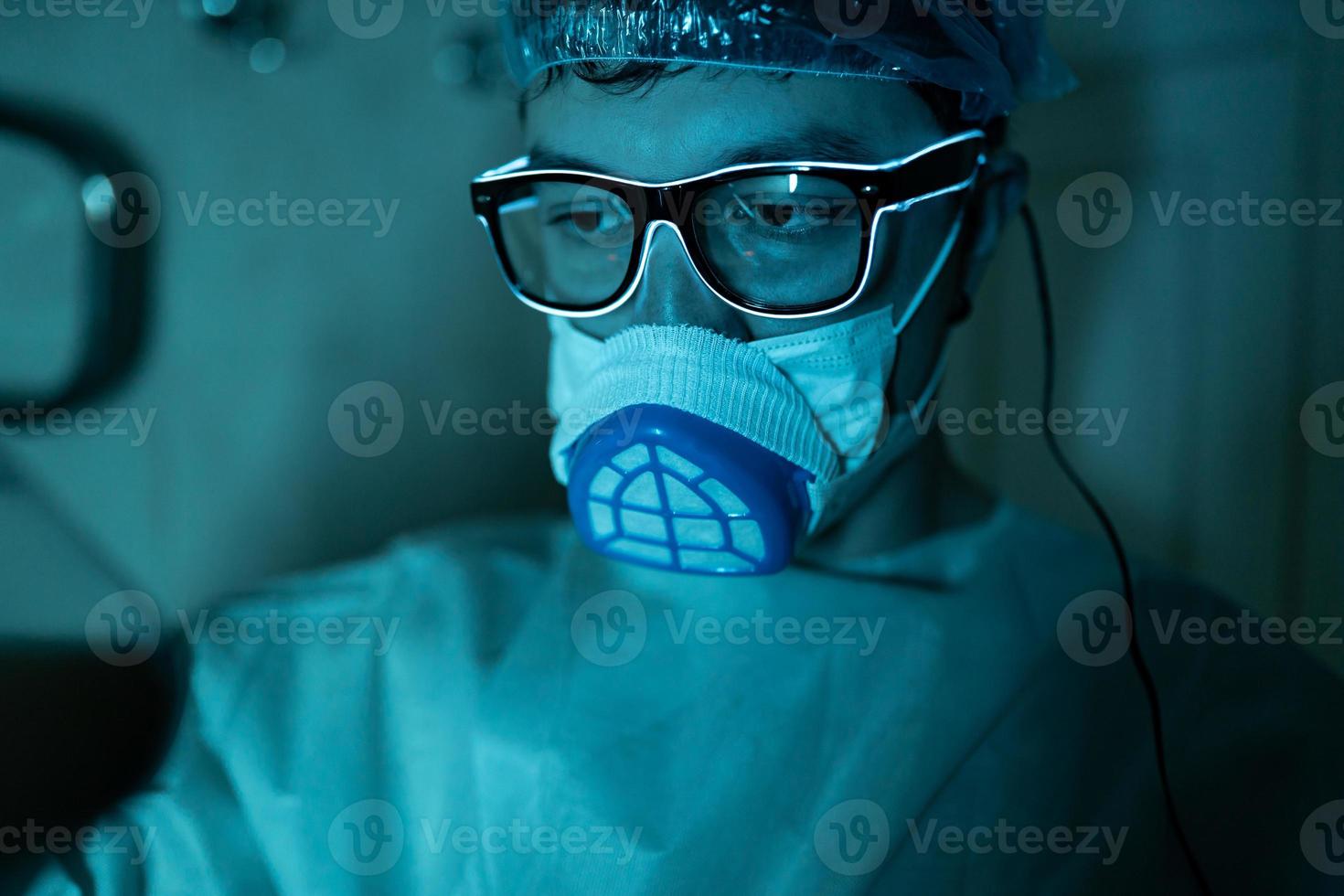 Young male researcher carrying out scientific experiment. photo