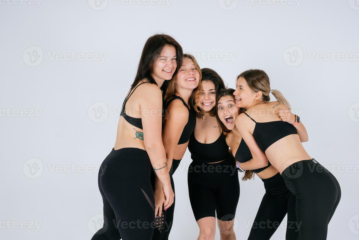 diverse models laughing, enjoying time together, look at camera photo