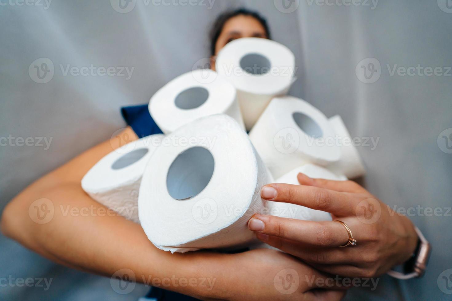 People are stocking up toilet paper for home quarantine from crownavirus. photo