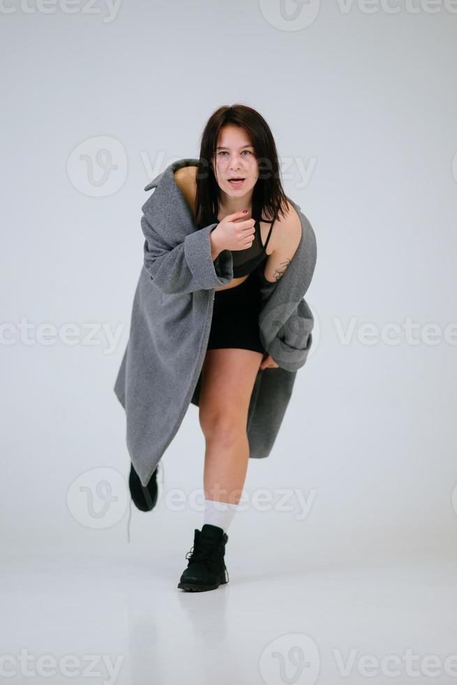 Plus size body positive woman wearing comfortable underwear and coat photo