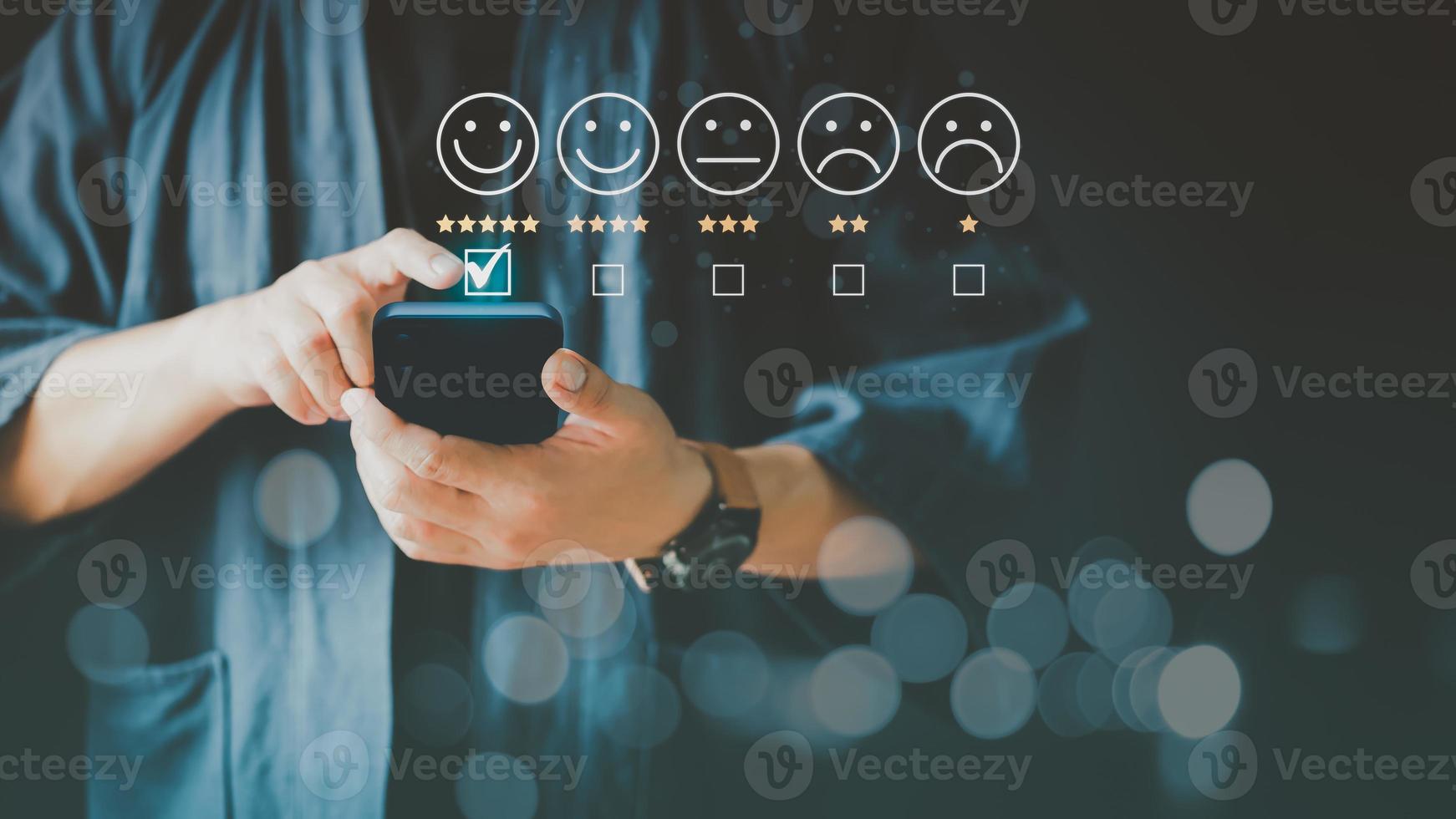 Man using a smartphone in give rating to service experience on application. Online customer review satisfaction feedback survey. photo